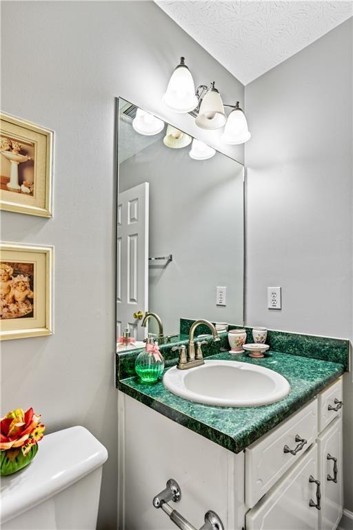13 Greystone Lane Northwest Cartersville, GA 30121 - Photo 41 of 61 a bathroom with a sink and a mirror