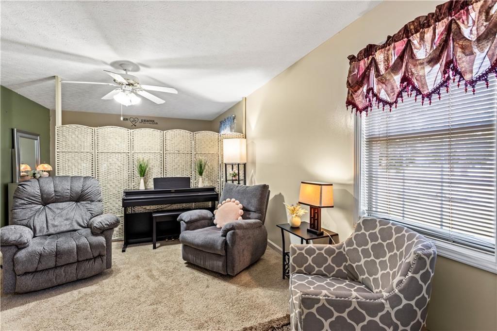 13 Greystone Lane Northwest Cartersville, GA 30121 - Photo 50 of 61 a living room with furniture and a large window