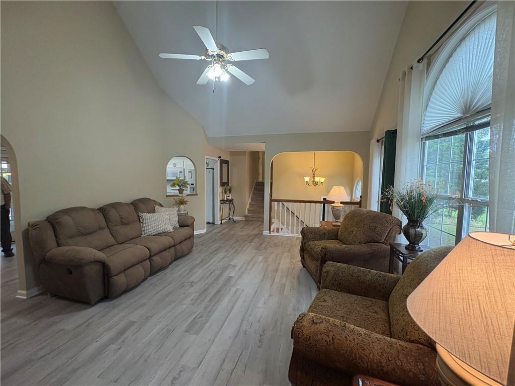 13 Greystone Lane Northwest Cartersville, GA 30121 - Photo 10 of 61 a living room with furniture and a chandelier