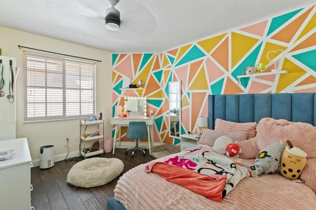 a bedroom with furniture and a window