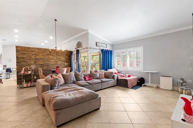 a living room with fireplace furniture and wooden floor