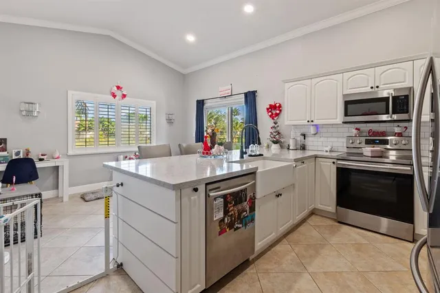 a kitchen with a sink stove and microwave