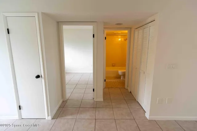 a view of a bathroom with a glass door