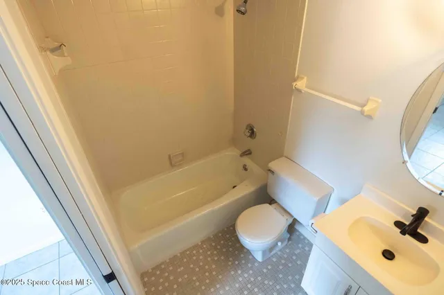 a bathroom with a sink a toilet and a bathtub