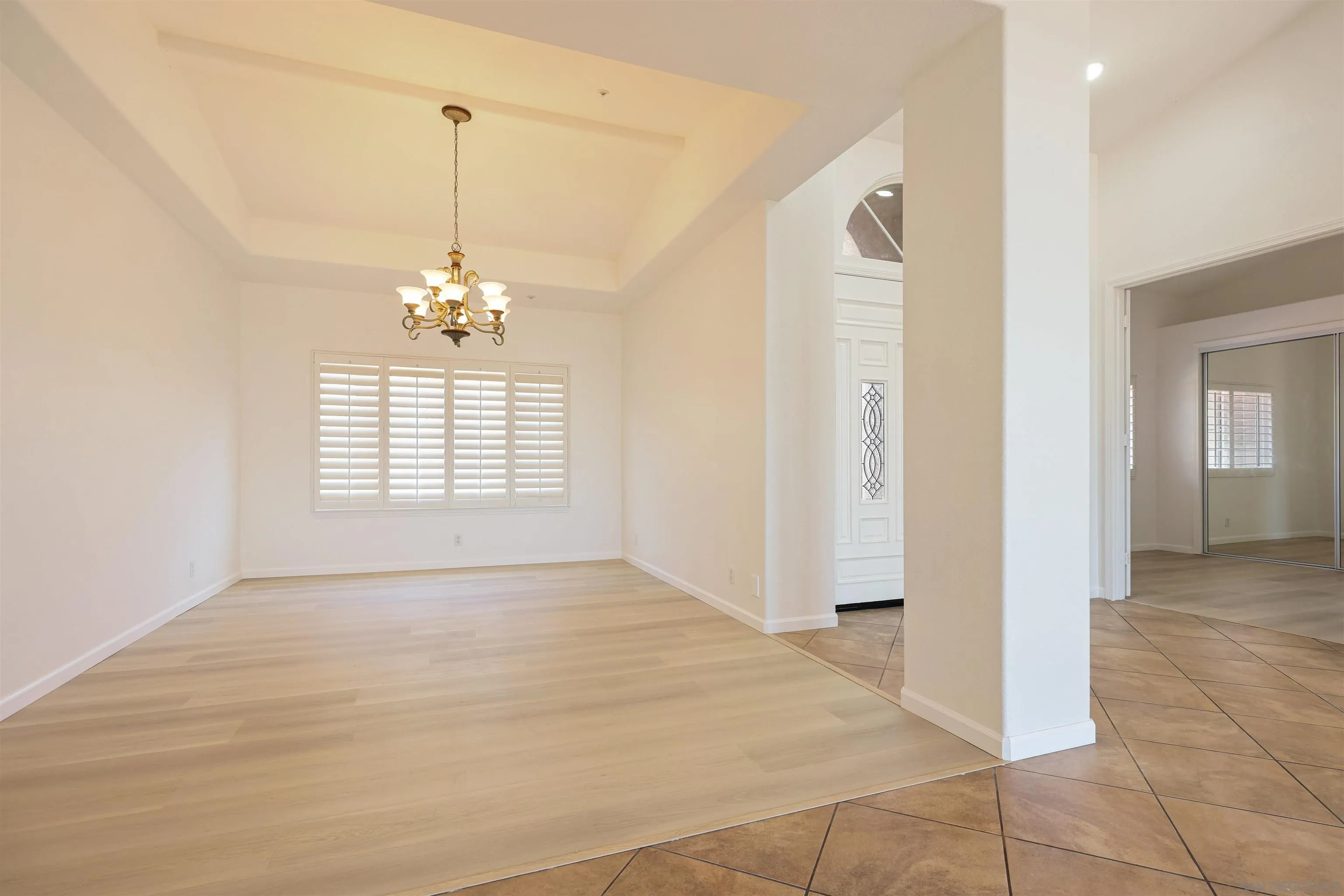 26335 Engelmann Road Valley Center, CA 92082 - Photo 35 of 42 a view of an empty room with window and chandelier fan