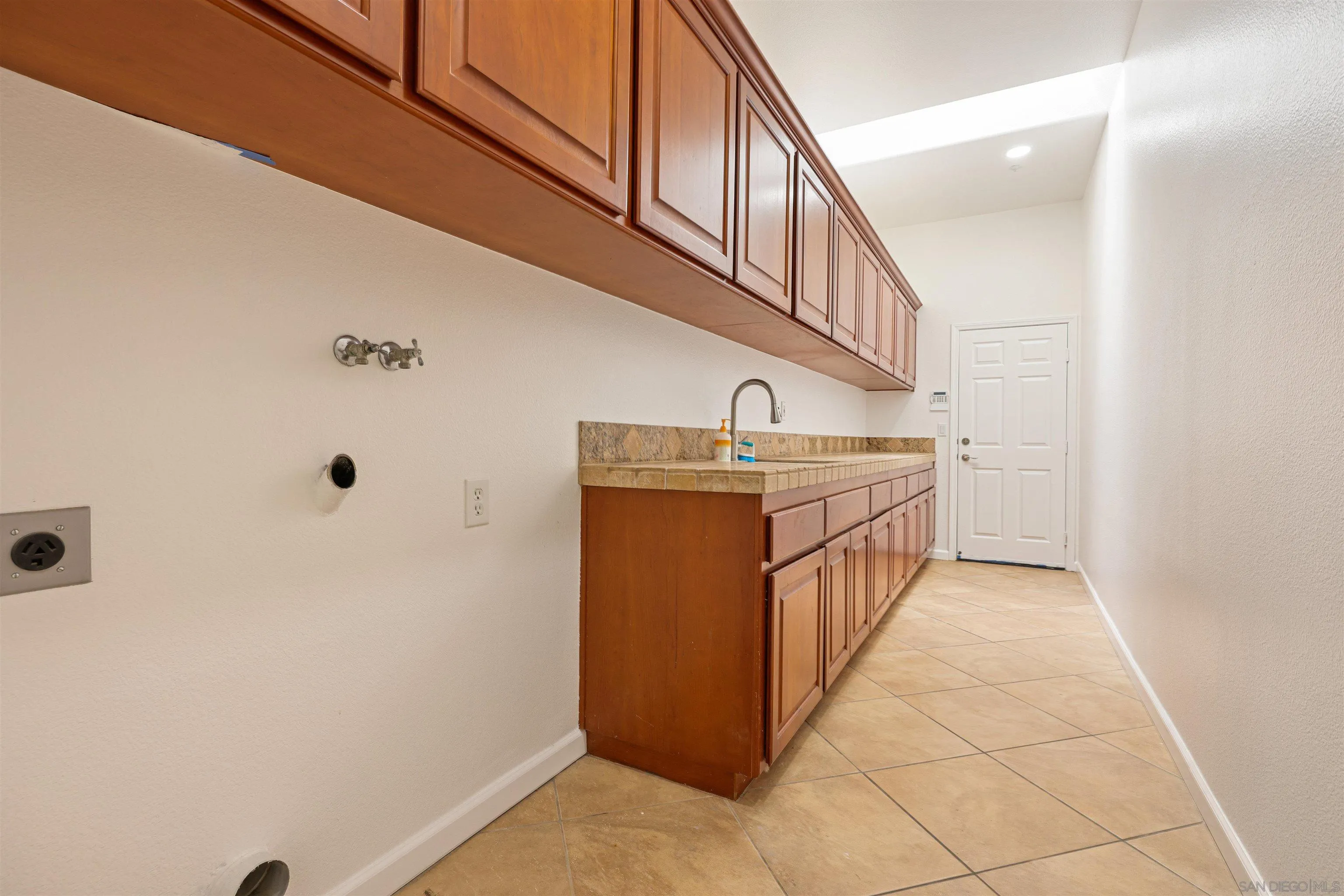 26335 Engelmann Road Valley Center, CA 92082 - Photo 38 of 42 a kitchen with stainless steel appliances a sink and cabinets