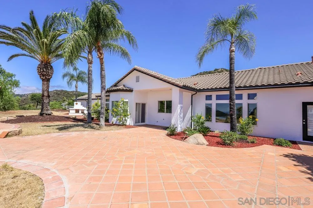 26335 Engelmann Road Valley Center, CA 92082 - Photo 5 of 42 a view of a house with a patio