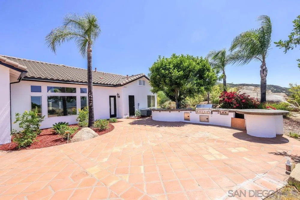 26335 Engelmann Road Valley Center, CA 92082 - Photo 6 of 42 a building outdoor space with potted plants