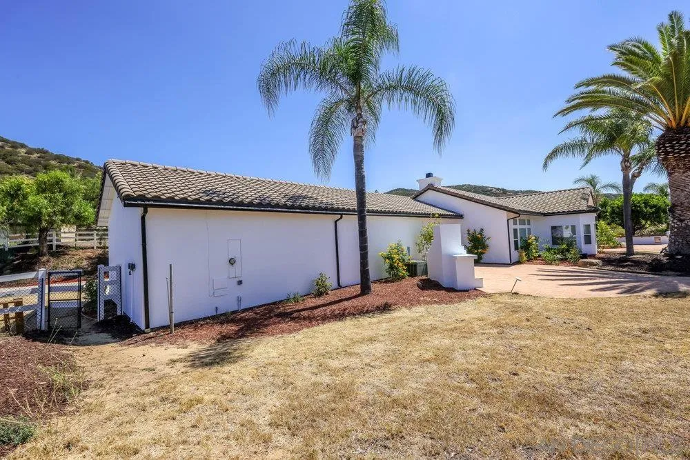 26335 Engelmann Road Valley Center, CA 92082 - Photo 7 of 42 a view of a house with a patio