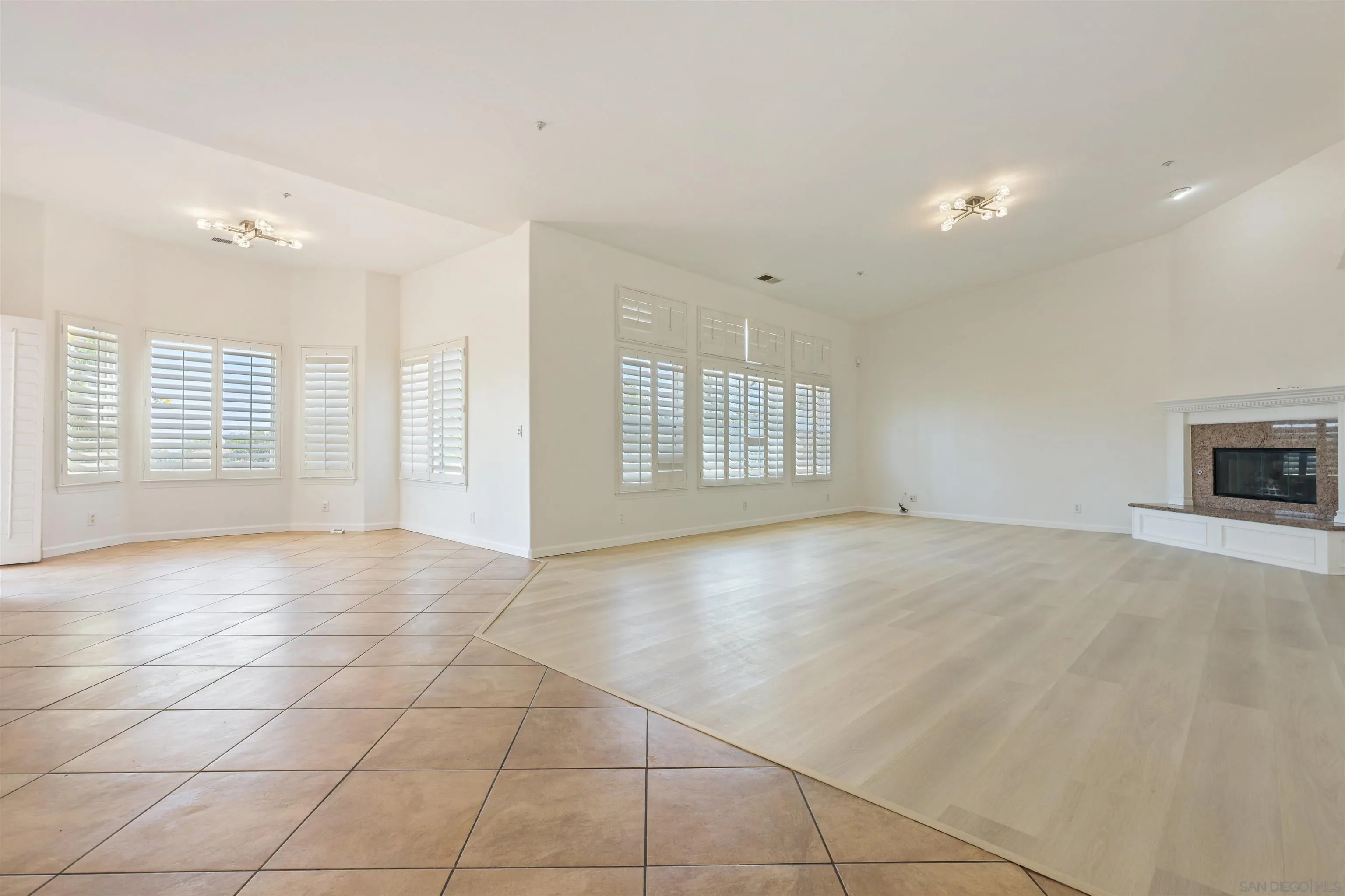 26335 Engelmann Road Valley Center, CA 92082 - Photo 10 of 42 a view of empty room with a fireplace and window