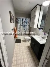 a bathroom with a sink a mirror and vanity