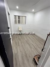 220 North 66th Avenue Hollywood, FL 33024 - Photo 5 of 8 an empty room with wooden floor