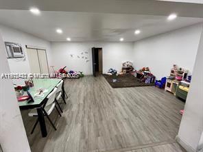 220 North 66th Avenue Hollywood, FL 33024 - Photo 7 of 8 a living room with furniture and a wooden floor