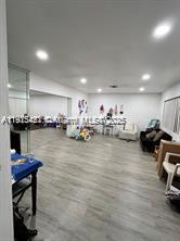 220 North 66th Avenue Hollywood, FL 33024 - Photo 8 of 8 a room with lots of chairs and wooden floor