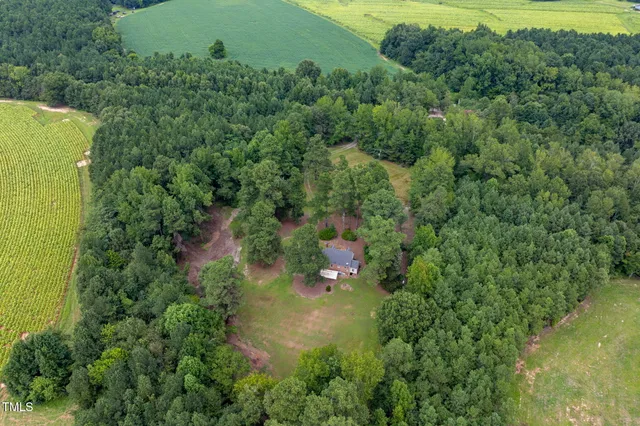 a view of a lake and green valley