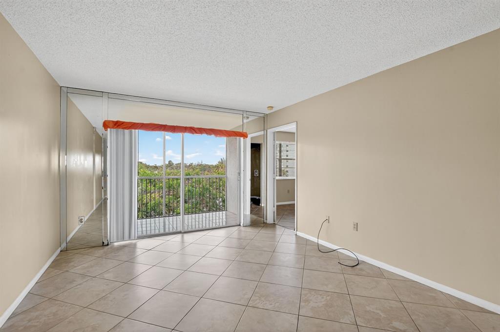 2236 North Cypress Bend Drive, Unit 508 Pompano Beach, FL 33069 - Photo 11 of 69 a view of an empty room and window