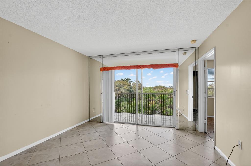 2236 North Cypress Bend Drive, Unit 508 Pompano Beach, FL 33069 - Photo 13 of 69 a view of an empty room and window