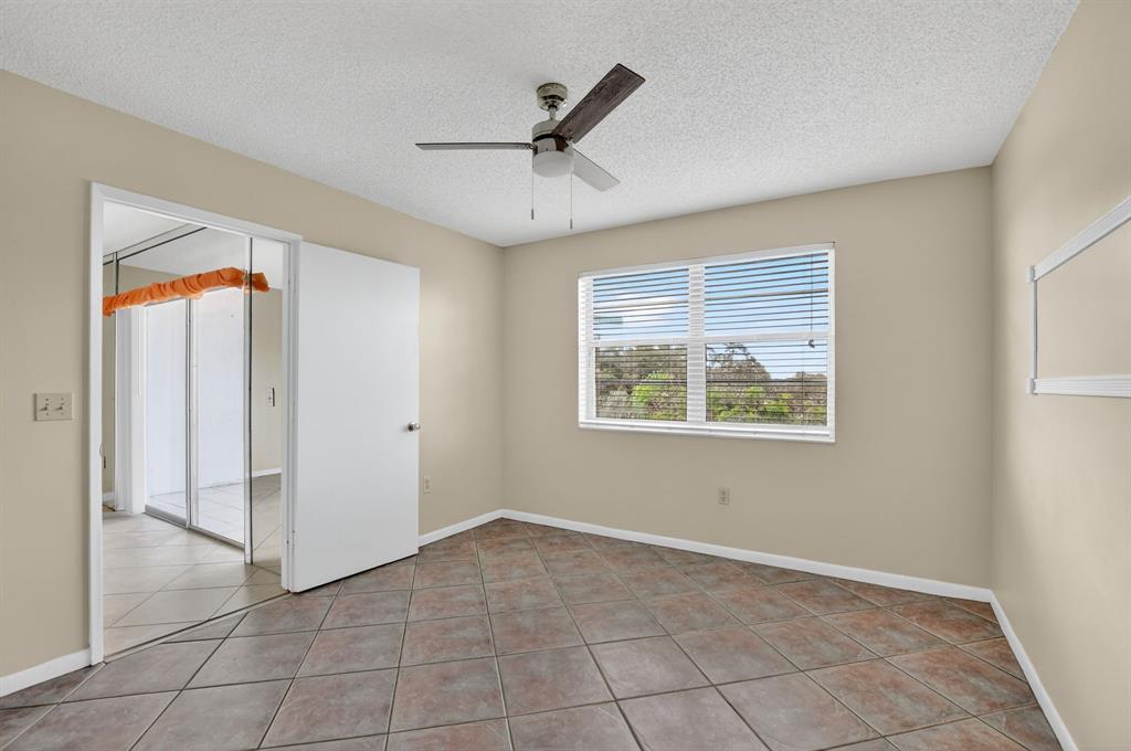 2236 North Cypress Bend Drive, Unit 508 Pompano Beach, FL 33069 - Photo 16 of 69 a view of an empty room with a window