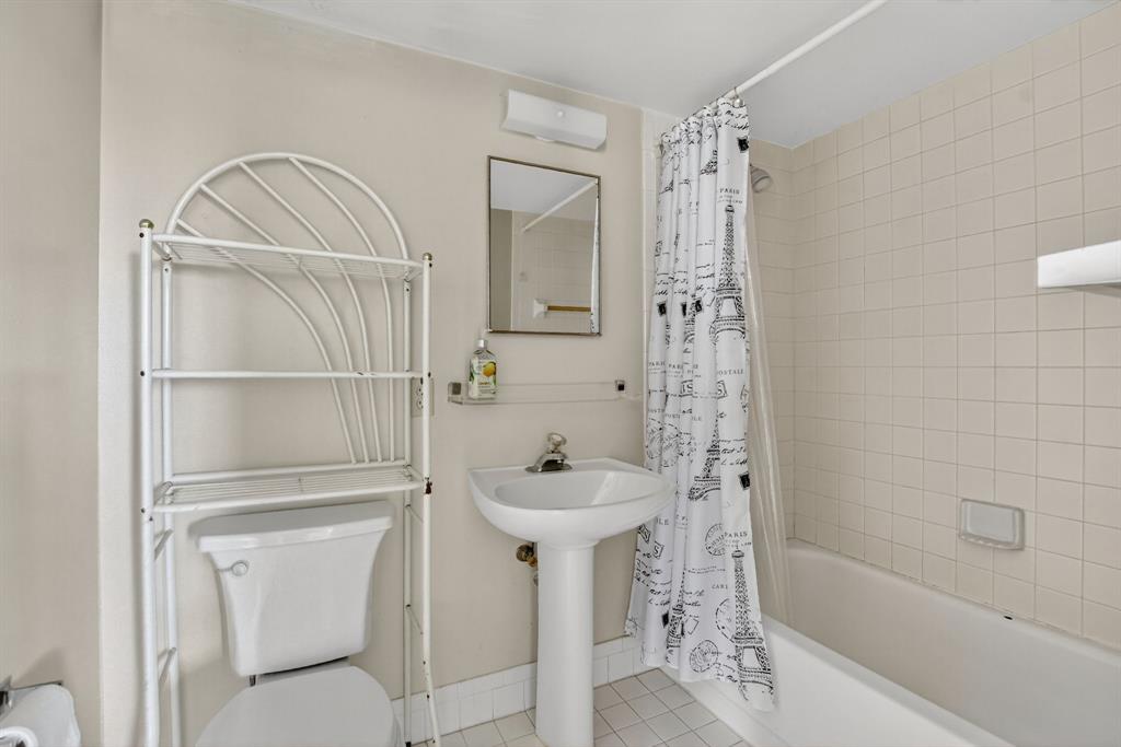 2236 North Cypress Bend Drive, Unit 508 Pompano Beach, FL 33069 - Photo 21 of 69 a bathroom with a sink a toilet and shower