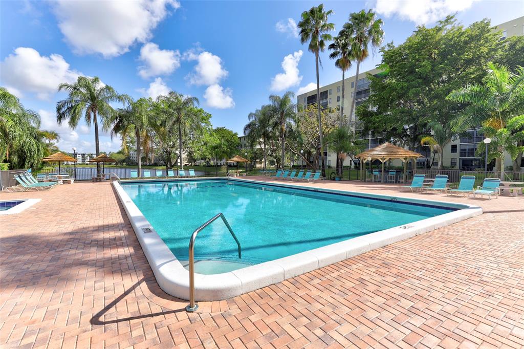 2236 North Cypress Bend Drive, Unit 508 Pompano Beach, FL 33069 - Photo 27 of 69 a view of a swimming pool with a patio