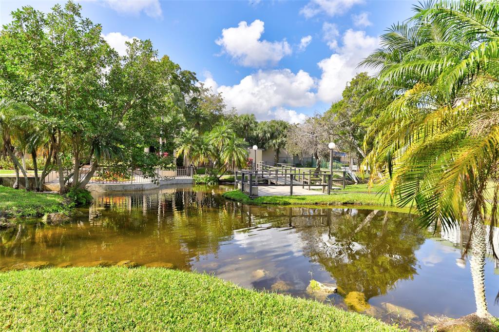 2236 North Cypress Bend Drive, Unit 508 Pompano Beach, FL 33069 - Photo 37 of 69 a view of a lake with houses
