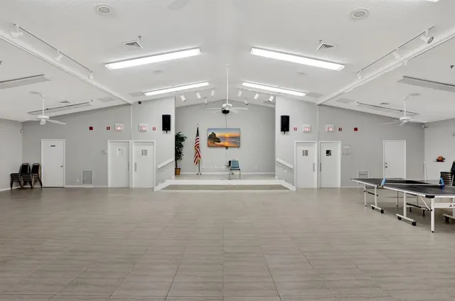 a view of a livingroom with furniture and chandelier