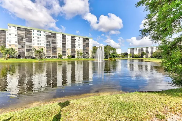 a view of a lake with a building in the background