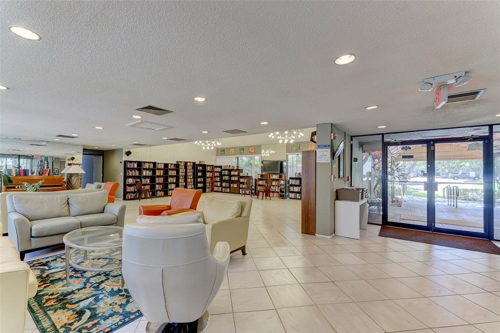 2236 North Cypress Bend Drive, Unit 508 Pompano Beach, FL 33069 - Photo 61 of 69 a living room with furniture and a large window