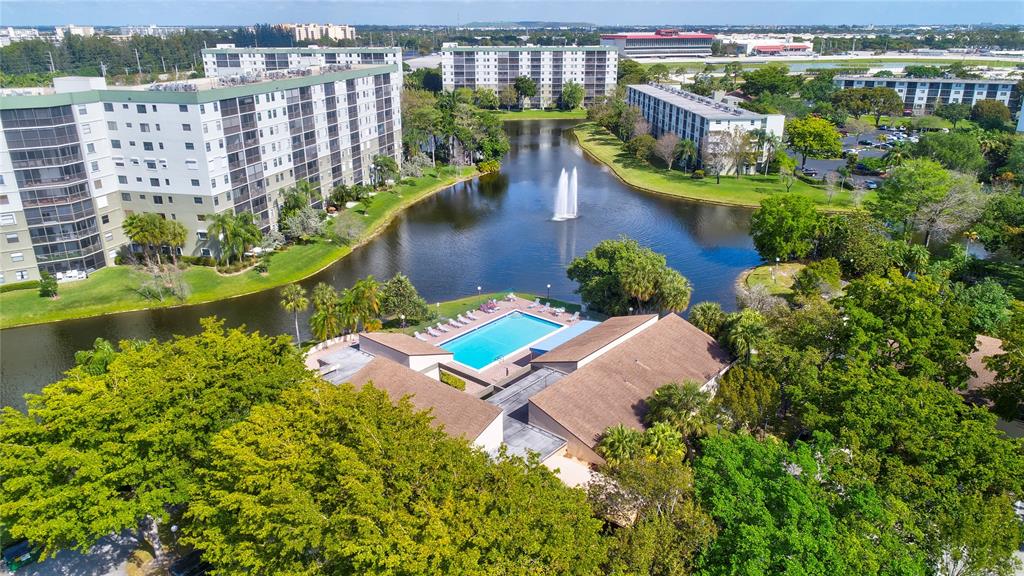 2236 North Cypress Bend Drive, Unit 508 Pompano Beach, FL 33069 - Photo 66 of 69 a view of a lake with a city