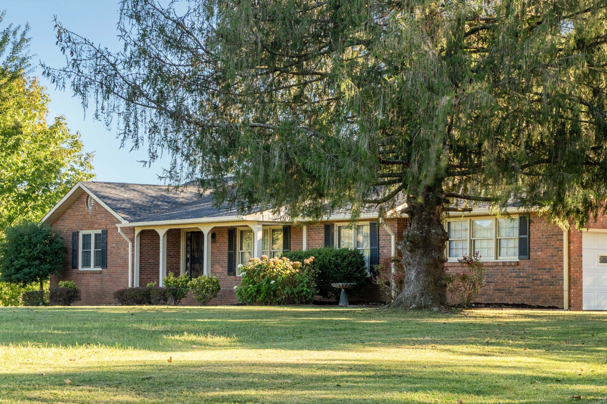 4509 Mt Sharon Road Greenbrier, TN 37073 - Photo 3 of 49 a front view of a house with a garden