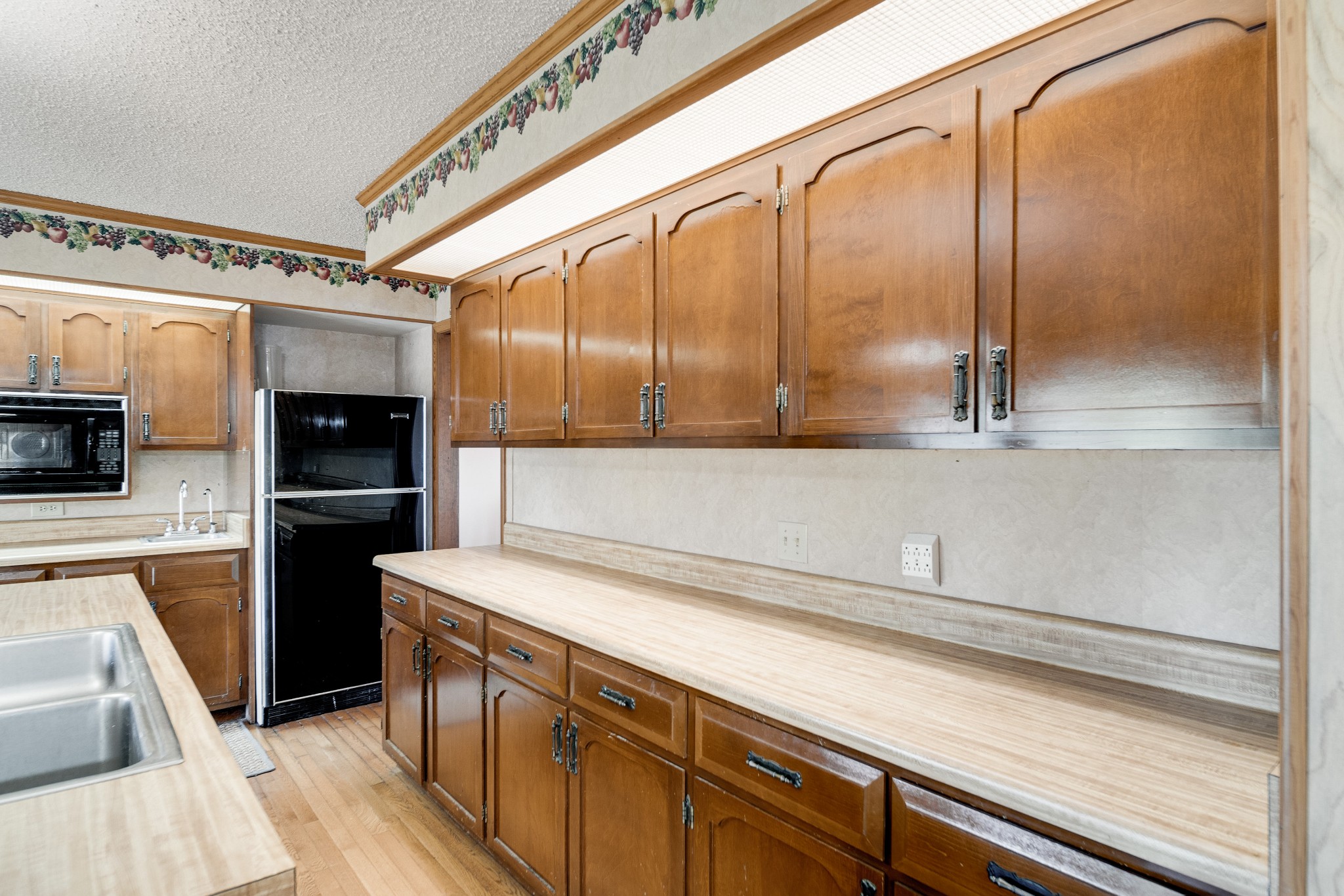4509 Mt Sharon Road Greenbrier, TN 37073 - Photo 22 of 49 a kitchen with a refrigerator and a sink