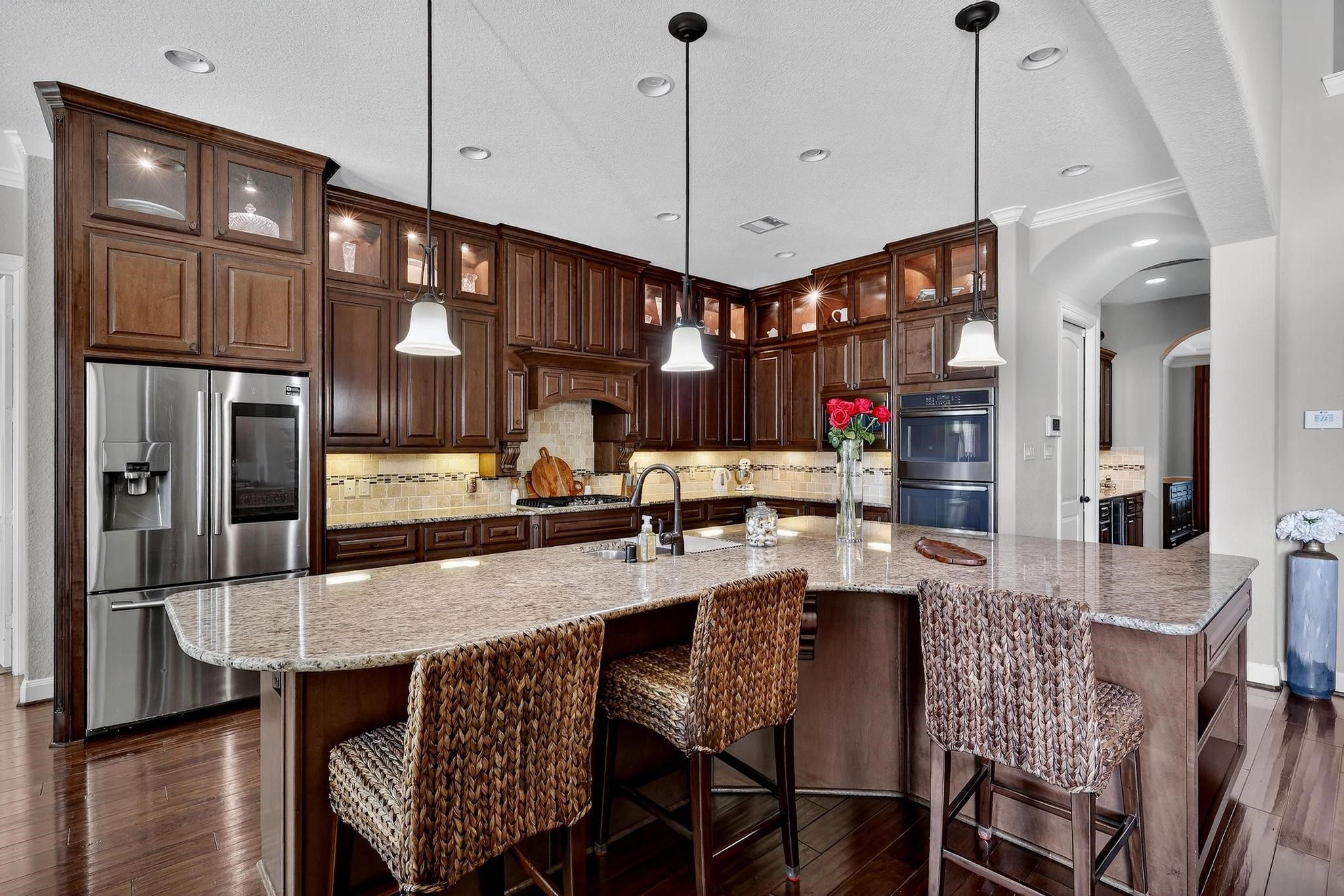 25803 Heritage Maple Drive Spring, TX 77389 - Photo 2 of 46 a view of kitchen and dining area with furniture