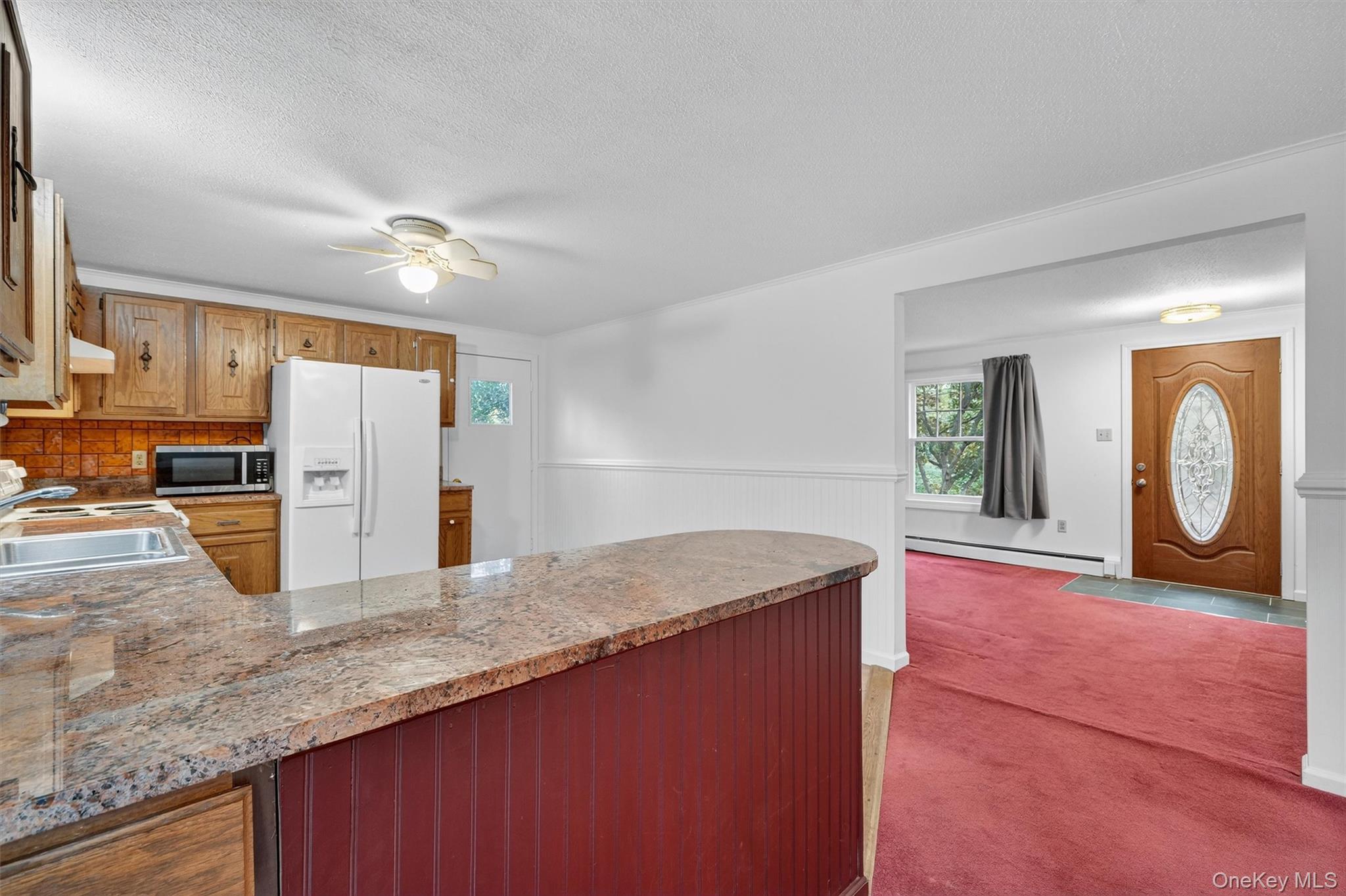 114 Laurel Hill Road Croton-on-Hudson, NY 10520 - Photo 11 of 34 a kitchen with stainless steel appliances granite countertop a sink a stove and a refrigerator