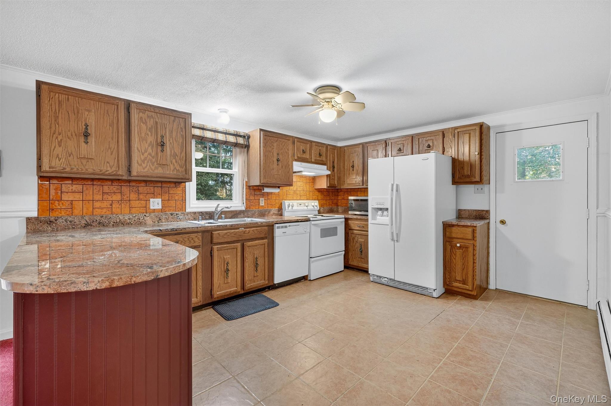 114 Laurel Hill Road Croton-on-Hudson, NY 10520 - Photo 13 of 34 a kitchen with a refrigerator a sink and dishwasher
