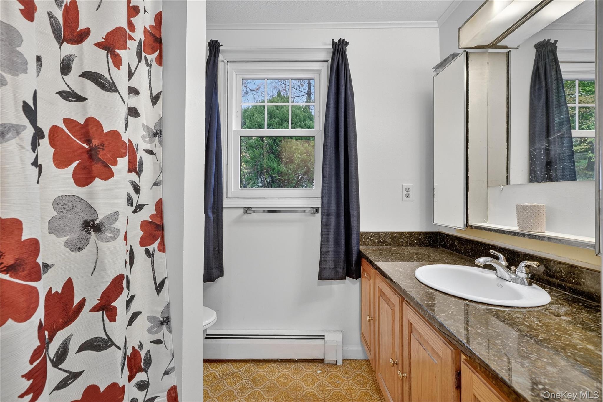 114 Laurel Hill Road Croton-on-Hudson, NY 10520 - Photo 24 of 34 a bathroom with a sink and a mirror