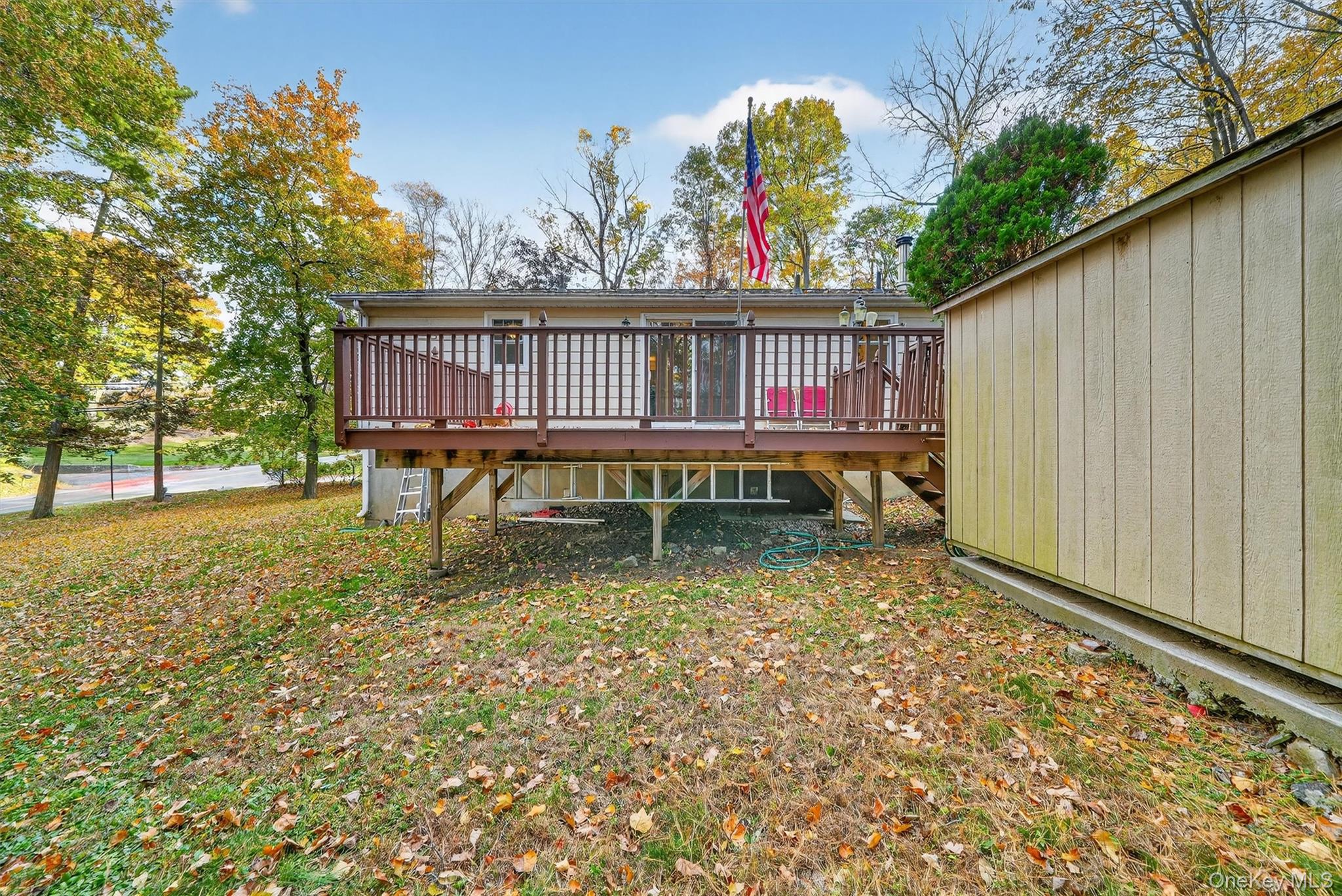 114 Laurel Hill Road Croton-on-Hudson, NY 10520 - Photo 32 of 34 a view of a backyard with a wooden deck and furniture