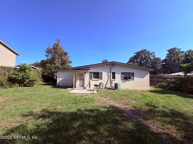 a house with trees in the background