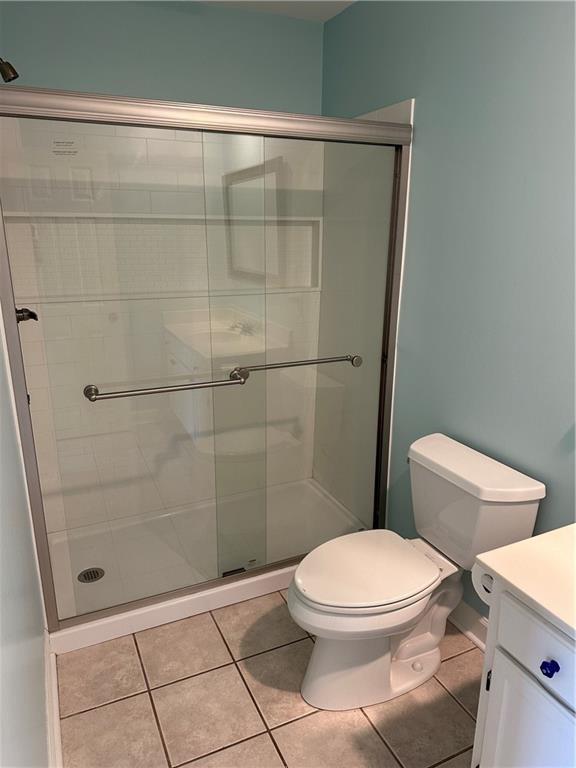 605 Candler Street, Unit C9 Gainesville, GA 30501 - Photo 13 of 18 a bathroom with a toilet and a shower