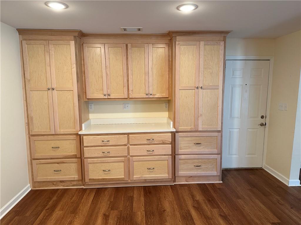 605 Candler Street, Unit C9 Gainesville, GA 30501 - Photo 4 of 18 a view of an empty room with wooden floor