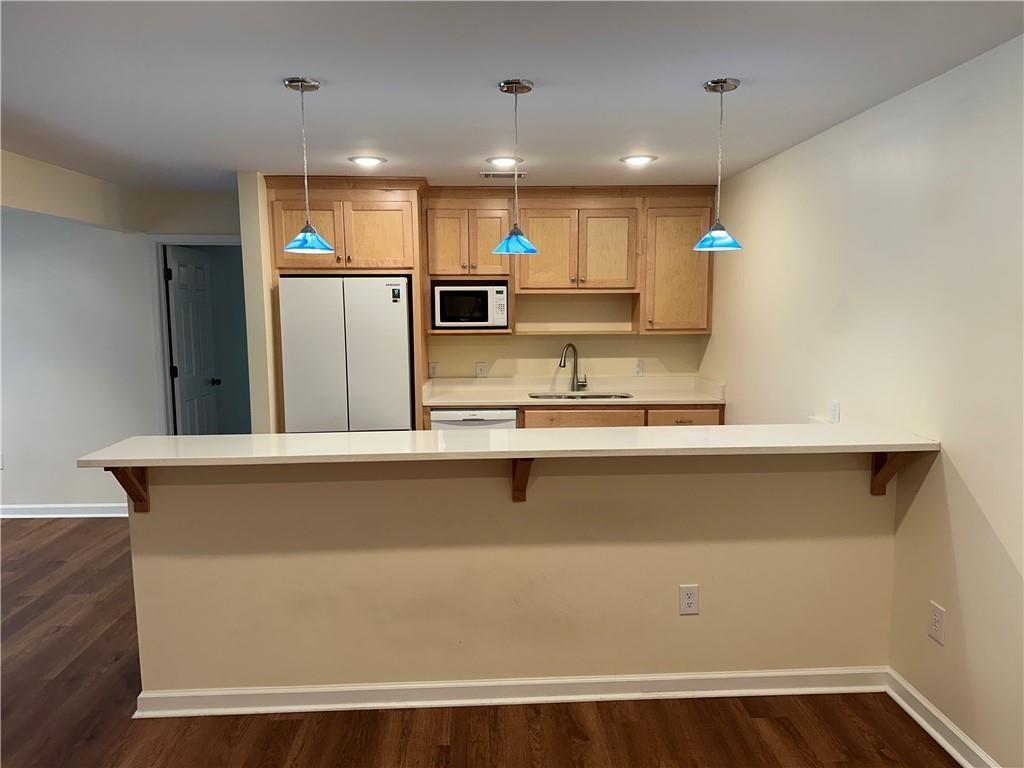605 Candler Street, Unit C9 Gainesville, GA 30501 - Photo 5 of 18 a view of kitchen with stainless steel appliances granite countertop a refrigerator a sink and a stove