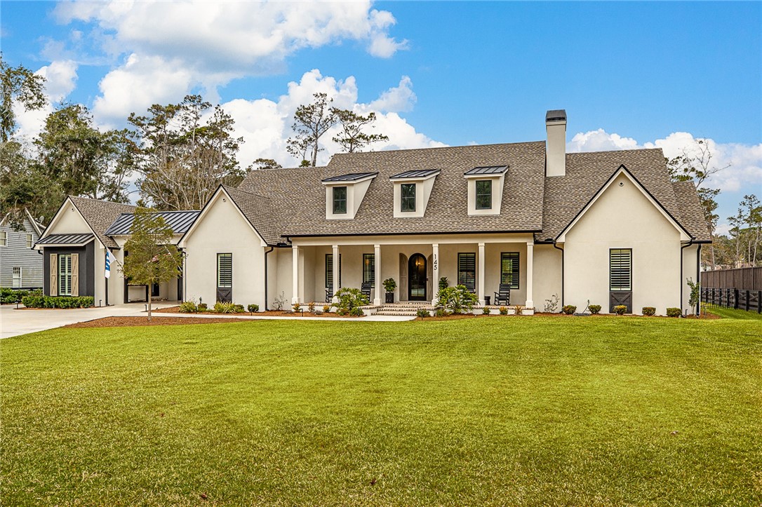 145 Butler Lake Drive St. Simons Island, GA 31522 - Photo 2 of 100 Spacious front yard