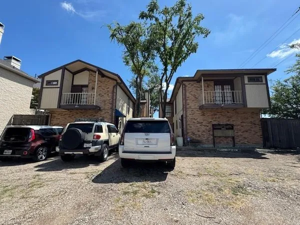 a view of a car parked in front of a house