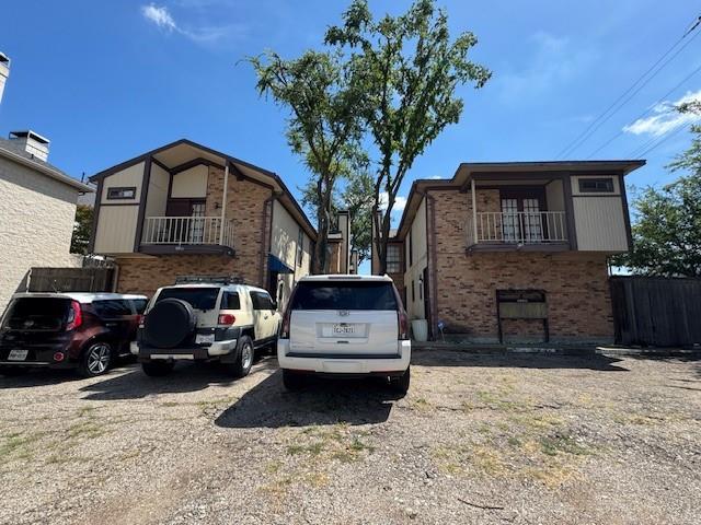 4000 Rawlins Street, Unit 101 Dallas, TX 75219 - Photo 26 of 27 a view of a car parked in front of a house