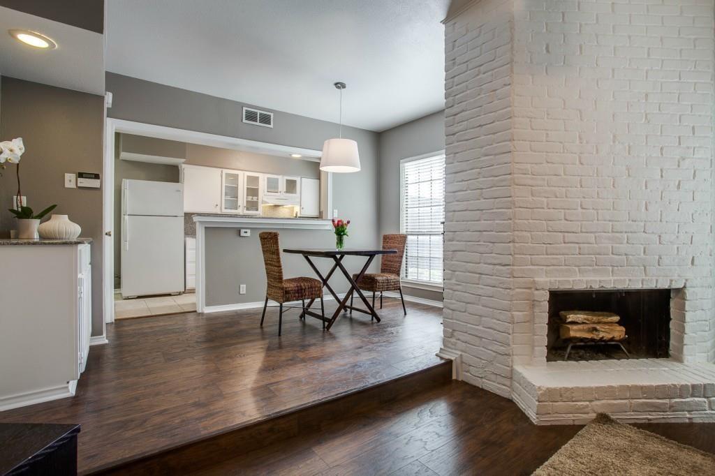 4000 Rawlins Street, Unit 101 Dallas, TX 75219 - Photo 4 of 27 a dining room with furniture and wooden floor