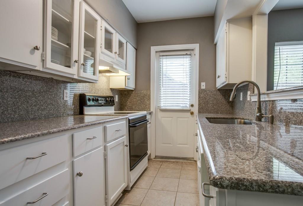 4000 Rawlins Street, Unit 101 Dallas, TX 75219 - Photo 9 of 27 a kitchen with stainless steel appliances granite countertop a sink and cabinets