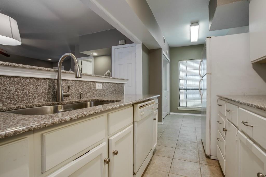 4000 Rawlins Street, Unit 101 Dallas, TX 75219 - Photo 10 of 27 a kitchen with a sink and cabinets