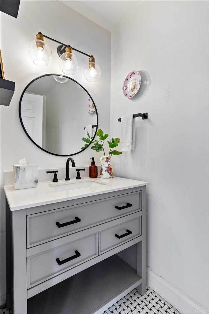 2121 West Division Street, Unit 1 Chicago, IL 60622 - Photo 11 of 18 a bathroom with a sink mirror and vanity