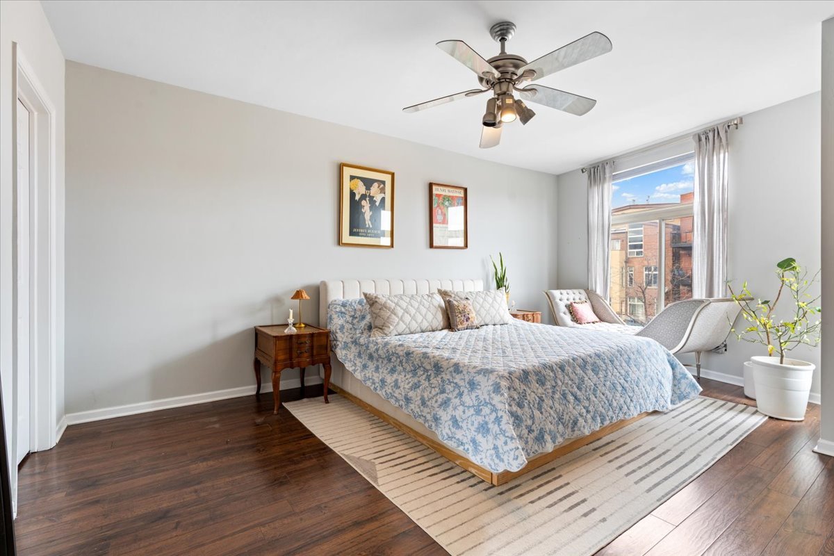 2121 West Division Street, Unit 1 Chicago, IL 60622 - Photo 13 of 18 a bed room with a bed and a chandelier