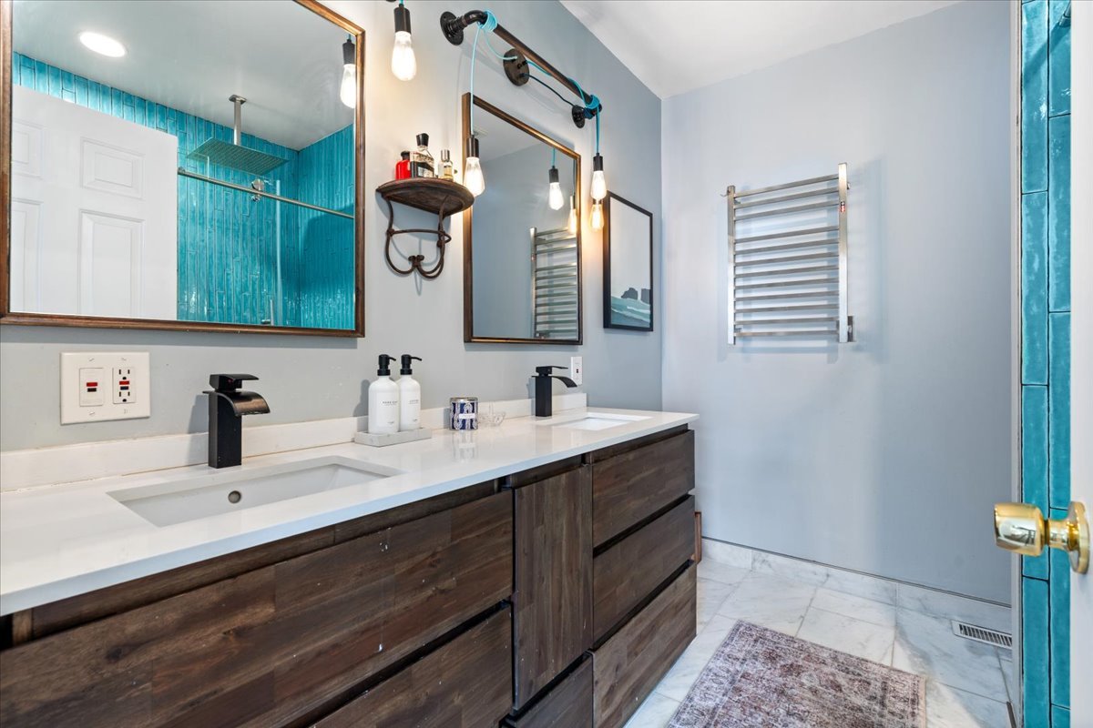 2121 West Division Street, Unit 1 Chicago, IL 60622 - Photo 14 of 18 a bathroom with a sink vanity and mirror