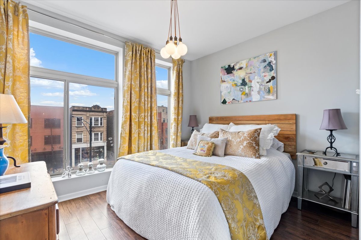 2121 West Division Street, Unit 1 Chicago, IL 60622 - Photo 15 of 18 a bedroom with bed and wooden floor
